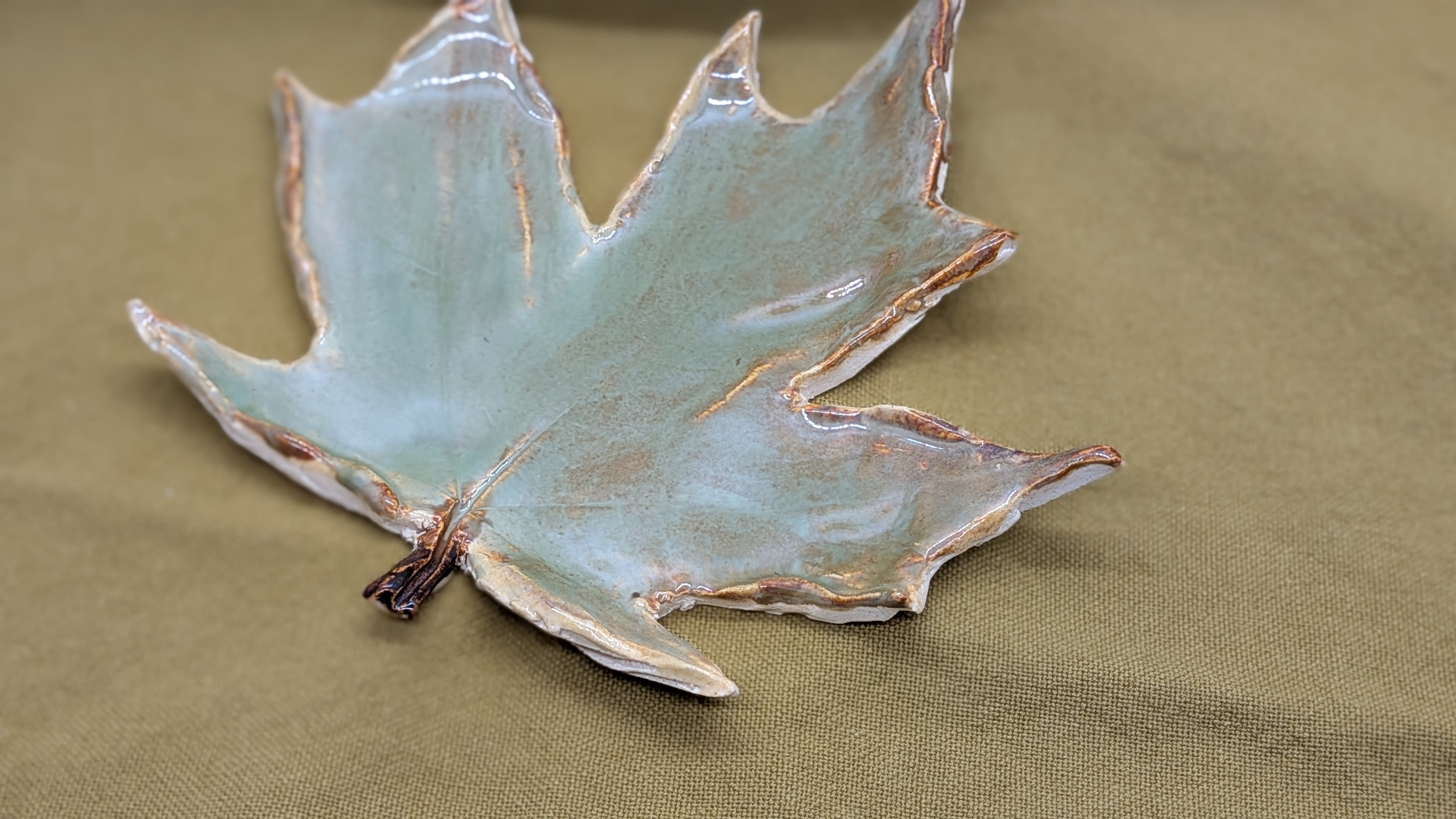Leaf Spoon Rest - If I were you, I'd definitely set this lovely leaf next to a candle, in a special spot where drinking tea or coffee while taking a break to read a book or meditate. This is a great gift for the mom in your life who loves bringing a little calm, nature-inspired joy into her daily routines.

Also, fun fact: I used a leaf off my own backyard Maple to create this piece.

The soft, springy green tones pair nicely with some of my small, Sugar and Spice scoops.
 - 20