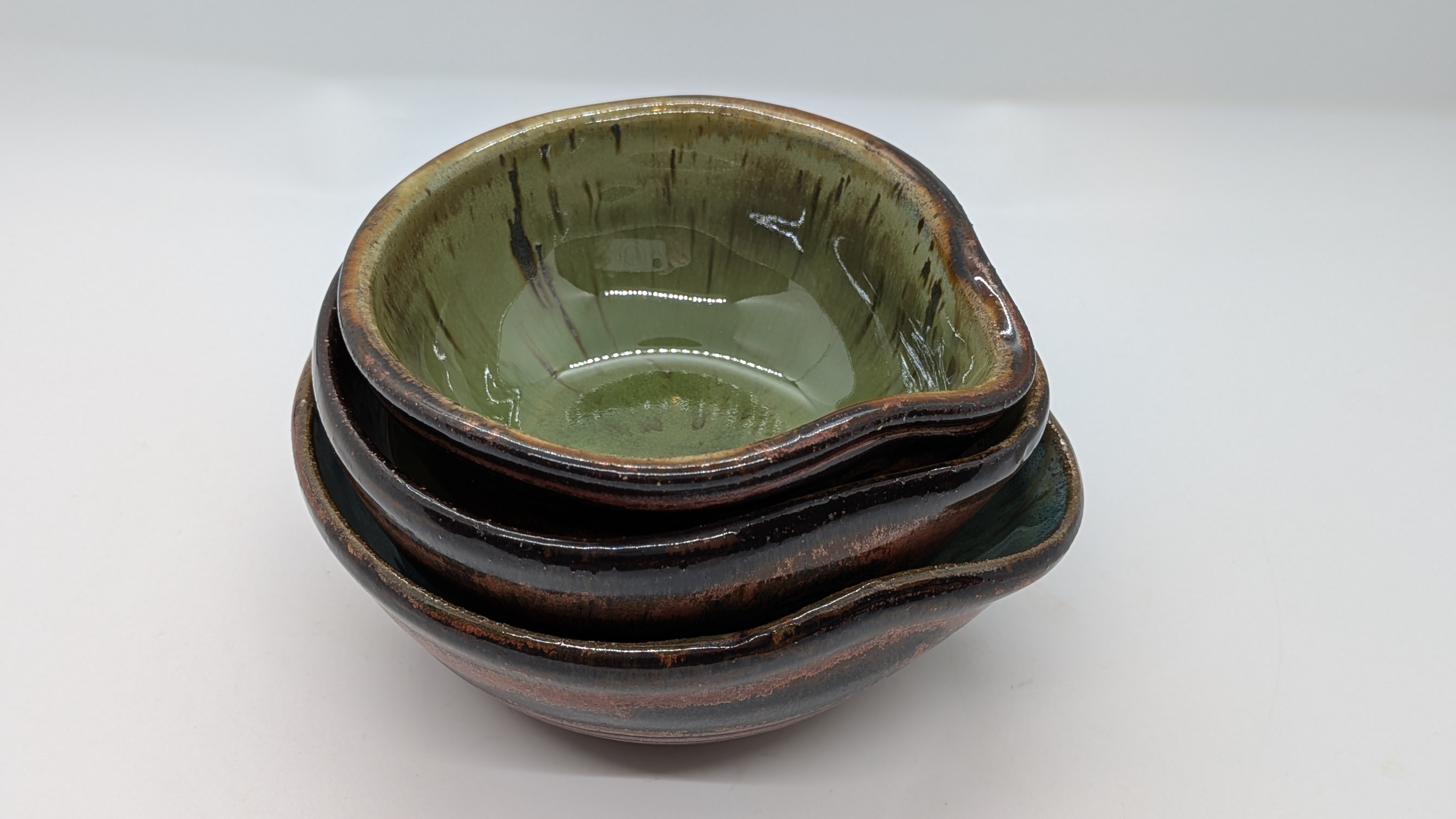 Not-so-matchy-matchy Prep Bowls - For a totally different look, this set features three bowls, all with the same, coppery exterior. But the insides were glazed in complementary shades of green - sure to give your countertop a real pop of color!

From olive tones to a slightly brighter, bluish-green, these would make a fantastic gift, and will look stunning in virtually any kitchen. In fact, you might have to hurry to grab them before I decide they're staying in mine. (Seriously.)

Perfect complement to that little <a href=https://dragonflydenarts.com/product/green-earth-open-mouth-salt-cellar>salt cellar with the green interior</a>, by the way!



 - 30