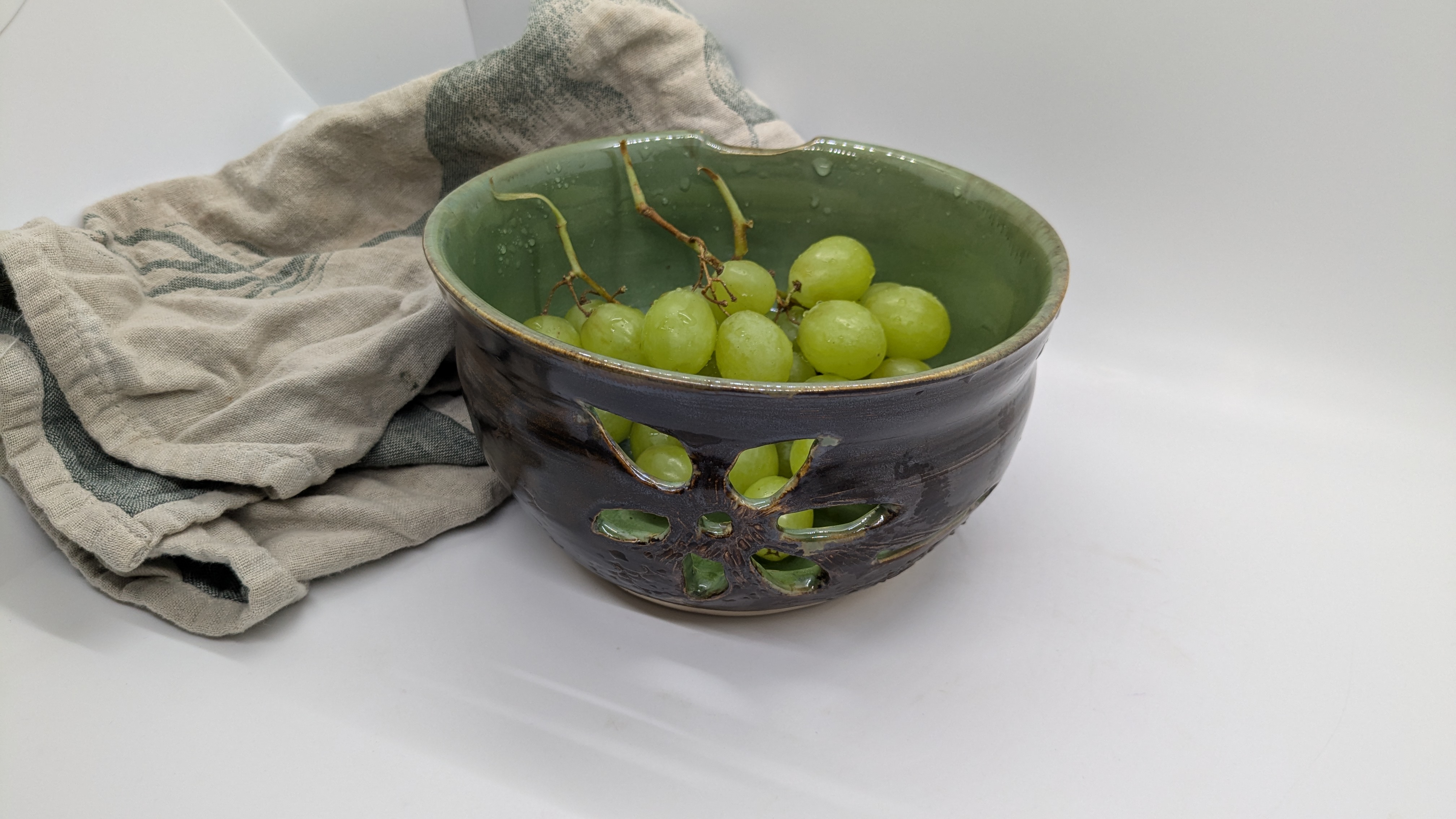 Jade & Copper Colander / Berry Bowl - Handcarved openings and a simple thumb notch let you easily rinse fresh fruits in this decorative-but-functional piece. The vibrant green interior is balanced by an earthy, coppery-brown exterior with subtle texture. - 45