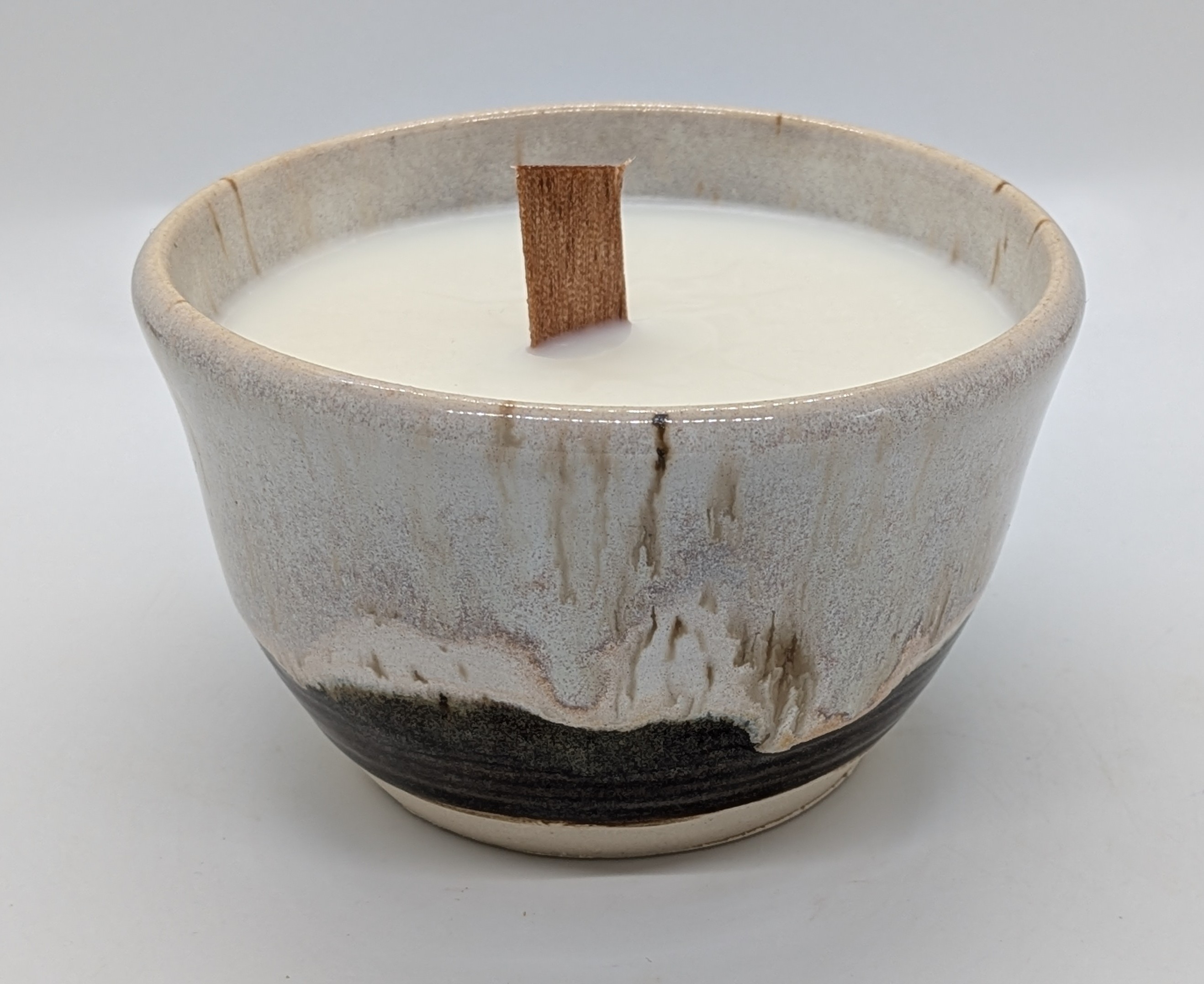 Crisp Winter Juice Cup Candle - XL - This vessel gave me a sweet surprise coming out of the kiln: a new favorite glaze combination that came out looking as soft as a toasted marshmallow. I'm sure I will be making s'more of these (sorry, terrible pun but I had to). It's a perfect, cozy look for your winter hygge decor!

Lightly scented with a fresh, "Crisp Winter" combo that I blended myself. Includes a little of each of my own favorite scents: Fir, Fig, and Jasmine.

The XL size holds about 10 fluid ounces once you've burned through the wax! Great for juice, but also works for hot beverages. - 25